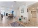 Hallway showcasing tile floors leading to dining room and entryway with decorated console table at 409 Antelope Way, Las Vegas, NV 89145