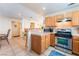 Bright and open kitchen with stainless steel appliances, tile floors, and a breakfast bar at 409 Antelope Way, Las Vegas, NV 89145
