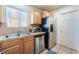 Functional kitchen with stainless steel appliances, ample cabinet space, and a view of the yard at 409 Antelope Way, Las Vegas, NV 89145