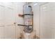 Utility room featuring a hot water tank with access to two separate rooms at 409 Antelope Way, Las Vegas, NV 89145