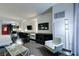 Open living area with contemporary furnishings, including a comfortable sofa and desk, with views into the bedroom and kitchen at 4381 Flamingo Rd # 2010, Las Vegas, NV 89103