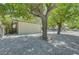Low maintenance backyard with rock landscaping and mature trees at 4424 Sunrise Ave, Las Vegas, NV 89110