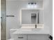 Bright bathroom with a new vanity, lighted mirror and modern fixtures at 4424 Sunrise Ave, Las Vegas, NV 89110