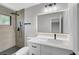 Bathroom featuring a new vanity, illuminated mirror, and tiled walk-in shower at 4424 Sunrise Ave, Las Vegas, NV 89110