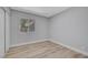 Bright bedroom with wood-look flooring, neutral walls and a window for natural light at 4424 Sunrise Ave, Las Vegas, NV 89110