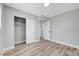 Well-lit bedroom with closet space, light wood-look flooring, and fresh paint at 4424 Sunrise Ave, Las Vegas, NV 89110