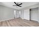 Bedroom featuring light wood-look flooring, closet and entrance to the bathroom at 4424 Sunrise Ave, Las Vegas, NV 89110