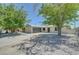 Beautiful single-story home featuring a driveway, two-car garage, and gravel yard at 4424 Sunrise Ave, Las Vegas, NV 89110