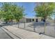 Well-maintained single-story home with a gravel front yard, chain-link fence, and two-car garage at 4424 Sunrise Ave, Las Vegas, NV 89110