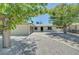 Beautiful single-story home featuring a driveway, two-car garage, and gravel yard at 4424 Sunrise Ave, Las Vegas, NV 89110