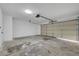 Spacious garage with concrete floors and an automatic door, ready for parking and storage at 4424 Sunrise Ave, Las Vegas, NV 89110