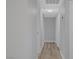 Hallway with new paint, light fixtures, and wood-look flooring at 4424 Sunrise Ave, Las Vegas, NV 89110