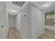 Hallway featuring closet space, wood-look floors and updated lighting at 4424 Sunrise Ave, Las Vegas, NV 89110