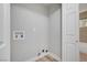 A bright and clean laundry room area with utility connections, ready for appliances at 4424 Sunrise Ave, Las Vegas, NV 89110