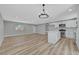 Open living area with new floors, a kitchen island, and lots of natural light at 4424 Sunrise Ave, Las Vegas, NV 89110