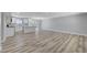 Open-concept living space featuring hardwood floors, a kitchen island, and abundant natural light at 4424 Sunrise Ave, Las Vegas, NV 89110