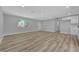 Spacious living room features light-colored wood flooring and a large window providing natural light at 4424 Sunrise Ave, Las Vegas, NV 89110