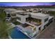 Beautiful aerial view of the modern home showcasing the pool, rooftop deck, and nearby community at 5 Highland Cove Ln, Henderson, NV 89011