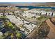 Stunning aerial view of the modern home showcasing its rooftop deck, pool, and proximity to the lake at 5 Highland Cove Ln, Henderson, NV 89011