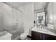Modern bathroom with a glass-enclosed shower, sleek vanity, and contemporary fixtures, offering a spa-like experience at 5 Highland Cove Ln, Henderson, NV 89011