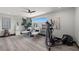 Bright bonus room with wood floors, large windows and exercise equipment at 5 Highland Cove Ln, Henderson, NV 89011
