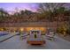 Serene backyard retreat with a modern fire pit, comfortable seating, and elegant landscaping at 5 Highland Cove Ln, Henderson, NV 89011