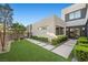 A modern home features a desert landscape, a walkway, and an inviting entryway at 5 Highland Cove Ln, Henderson, NV 89011