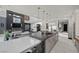 Gourmet kitchen with island and view to living and dining areas at 5 Highland Cove Ln, Henderson, NV 89011
