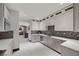 Gourmet kitchen with custom cabinets and stone countertops with view to dining area at 5 Highland Cove Ln, Henderson, NV 89011