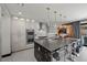 Spacious kitchen with bar seating and high-end finishes at 5 Highland Cove Ln, Henderson, NV 89011