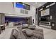 Grand living room with fireplace and wet bar access at 5 Highland Cove Ln, Henderson, NV 89011