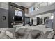 Contemporary living room with fireplace and second story access at 5 Highland Cove Ln, Henderson, NV 89011
