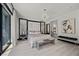 Serene main bedroom with natural light, chandelier, and modern decor at 5 Highland Cove Ln, Henderson, NV 89011