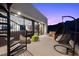 This modern patio has an outdoor fireplace, spiral staircase, and stunning views at 5 Highland Cove Ln, Henderson, NV 89011