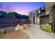 This modern patio has an outdoor fireplace, spiral staircase, and stunning views at 5 Highland Cove Ln, Henderson, NV 89011