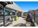 This modern patio has an outdoor fireplace, spiral staircase, and stunning views at 5 Highland Cove Ln, Henderson, NV 89011