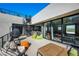 This modern patio has an outdoor fireplace, spiral staircase, and stunning views at 5 Highland Cove Ln, Henderson, NV 89011