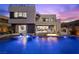 Stunning modern home with a luxurious pool featuring a fire feature and integrated lounge chairs at 5 Highland Cove Ln, Henderson, NV 89011