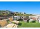 Spacious rooftop deck with outdoor kitchen and seating, ideal for entertaining with neighborhood views at 5 Highland Cove Ln, Henderson, NV 89011