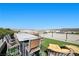 Expansive rooftop deck featuring a dining area, lounge seating, and scenic city views at 5 Highland Cove Ln, Henderson, NV 89011