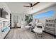 Bright spa room featuring two treatment chairs, wood floors, a tree accent, and a ceiling fan at 5 Highland Cove Ln, Henderson, NV 89011
