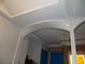 Archway feature displaying interior view of kitchen and living room area at 5068 Killarney St, Las Vegas, NV 89122