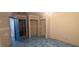 A room featuring unique flooring, with an open closet and a door leading to another area at 5068 Killarney St, Las Vegas, NV 89122