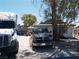 Modest single-story home with a truck and vehicle parked in the front at 5068 Killarney St, Las Vegas, NV 89122