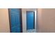 Hallway features two blue doors and decorative paint at 5068 Killarney St, Las Vegas, NV 89122