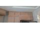 A view of the bare kitchen cabinets at 5068 Killarney St, Las Vegas, NV 89122