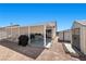 Large backyard featuring a covered patio and additional storage shed at 5117 Axbridge Ct, North Las Vegas, NV 89031