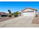 Charming single-story home with a two-car garage and manicured landscaping at 5117 Axbridge Ct, North Las Vegas, NV 89031
