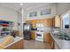 Functional kitchen features stainless appliances, tile flooring, and ample counter space at 5117 Axbridge Ct, North Las Vegas, NV 89031