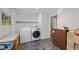 Bright laundry room with washer, dryer, storage and exterior access at 5117 Axbridge Ct, North Las Vegas, NV 89031